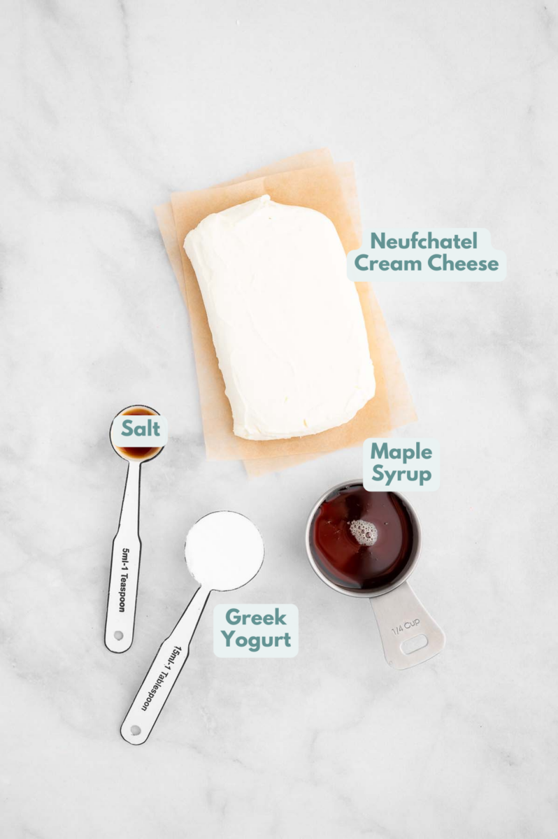 Ingredients for healthy cream cheese frosting on a white background: Neufchatel cheese, Greek Yogurt, Maple Syrup, Sea Salt