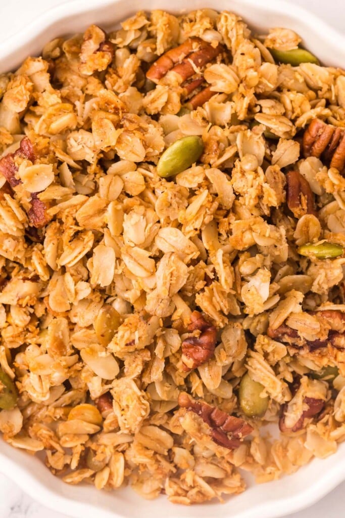 A white bowl of homemade vanilla granola