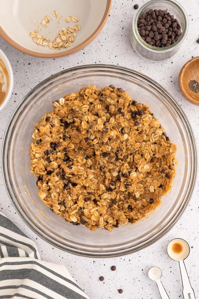 Peanut Butter Energy Ball Dough in a clear bowl before being shaped into balls