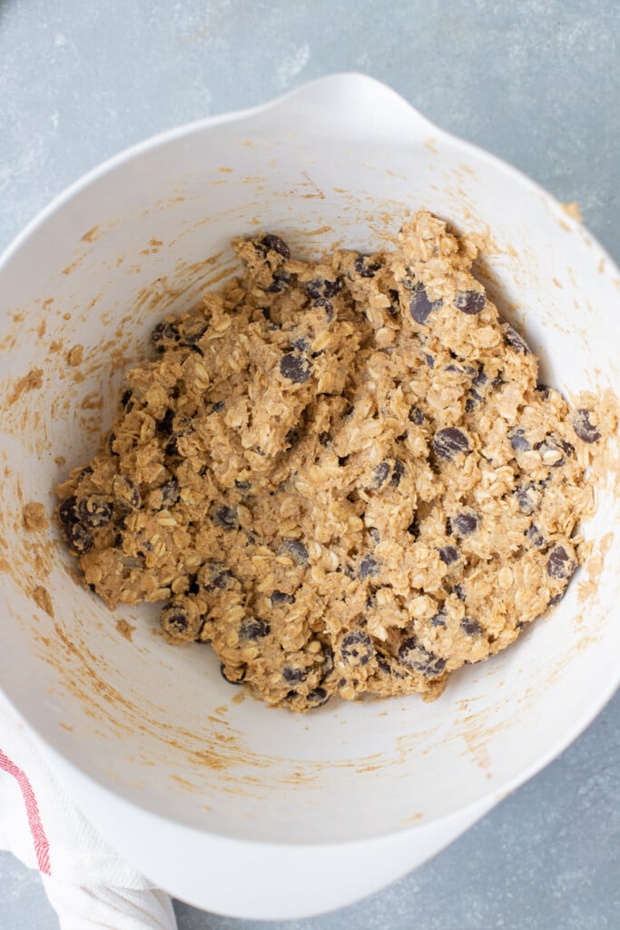 Healthy Oatmeal Chocolate Chip Cookie Dough in a white bowl on a grey counter