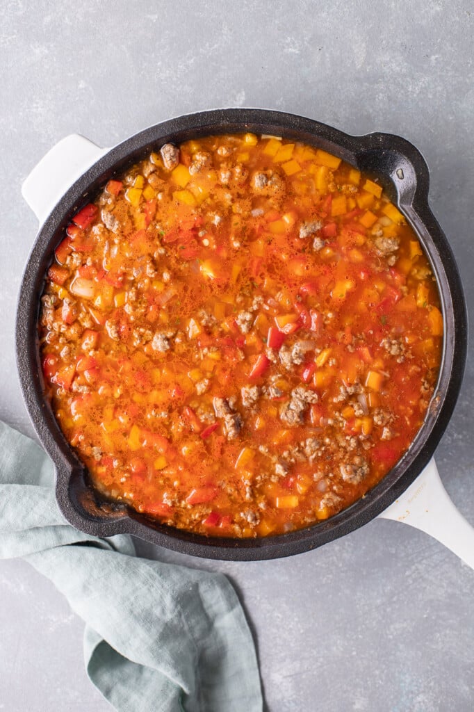 All ingredients (except cheese) in a skillet to make unstuffed bell pepper skillet before cooking