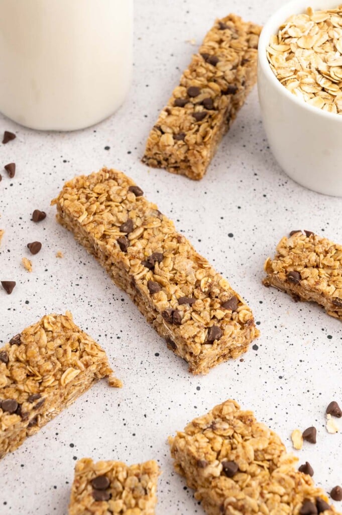 Healthy granola bars on a grey countertop with mini chocolate chips between them