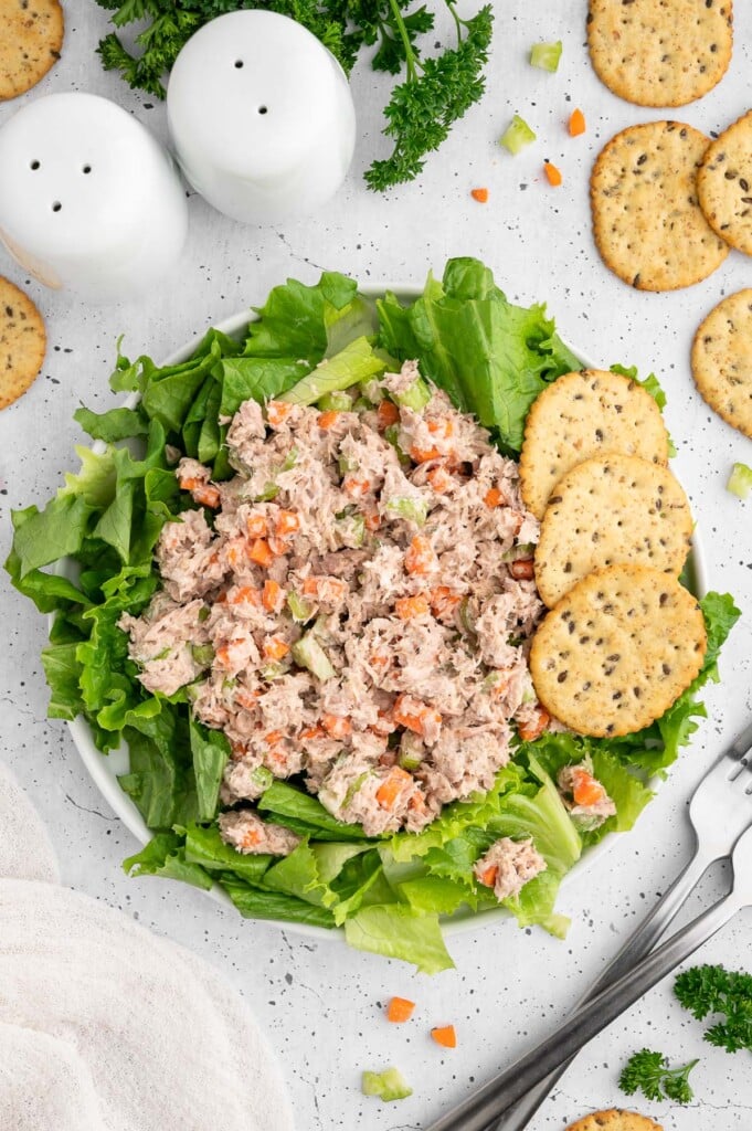 The best tuna salad without mayo on top of a salad in a small white bowl.