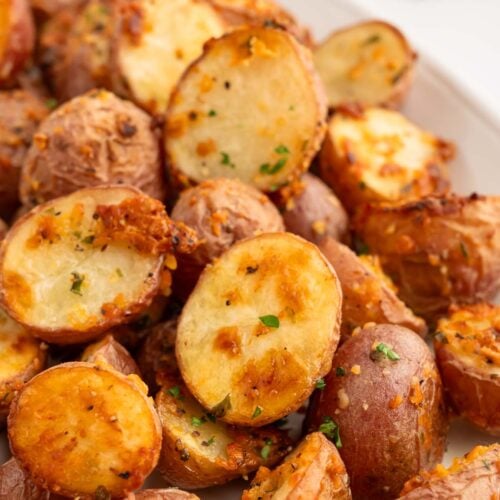 Garlic Roasted Potatoes on a white platter.