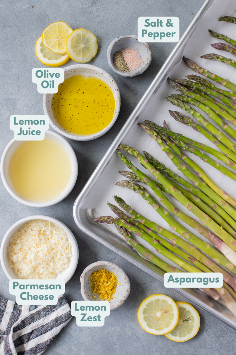 Ingredients for Lemon Asparagus in white bowls on a grey background: asparagus, lemon juice, lemon zest, olive oil, parmesan cheese, salt and pepper