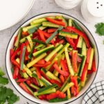 An overhead shot of marinated vegetable salad in a large bowl.