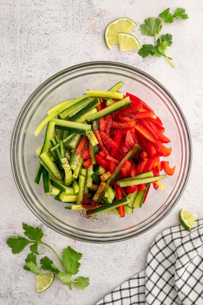 Ingredients for Marinated vegetable salad in a clear bowl before mixing together. 