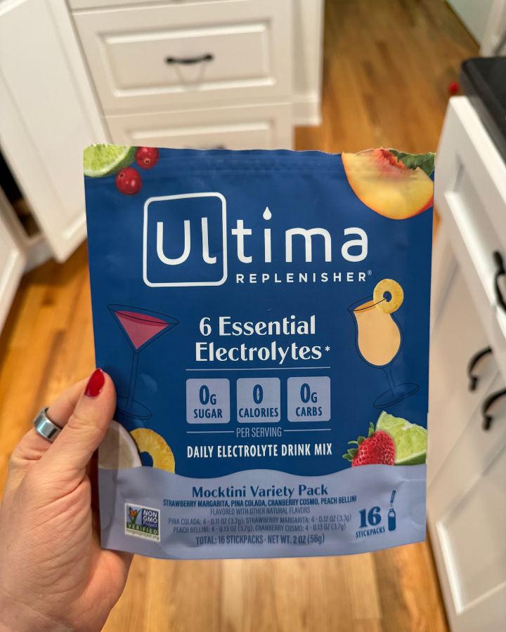 a hand holding up Ultima mocktail electrolytes packaging
