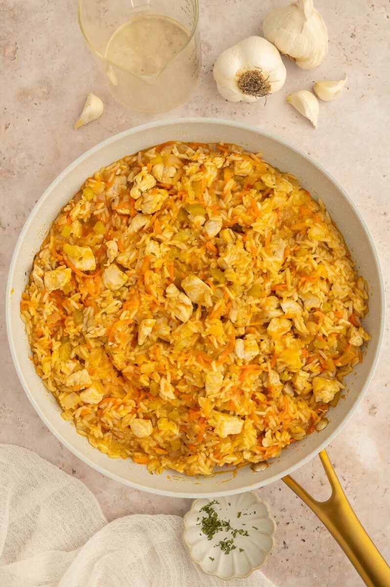Buffalo Chicken and Rice Skillet in a pan on a counter. 