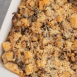 Sourdough Sausage Stuffing in a white baking dish.