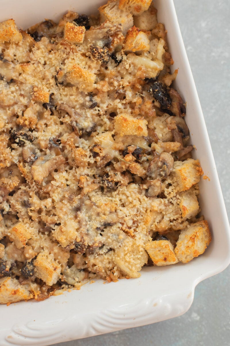 Sourdough Sausage Stuffing in a white baking dish.