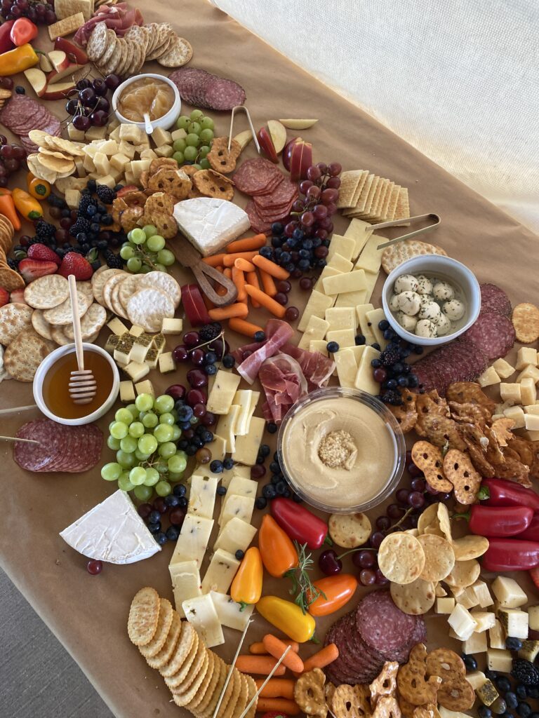 A close up of a charcuterie board on brown paper