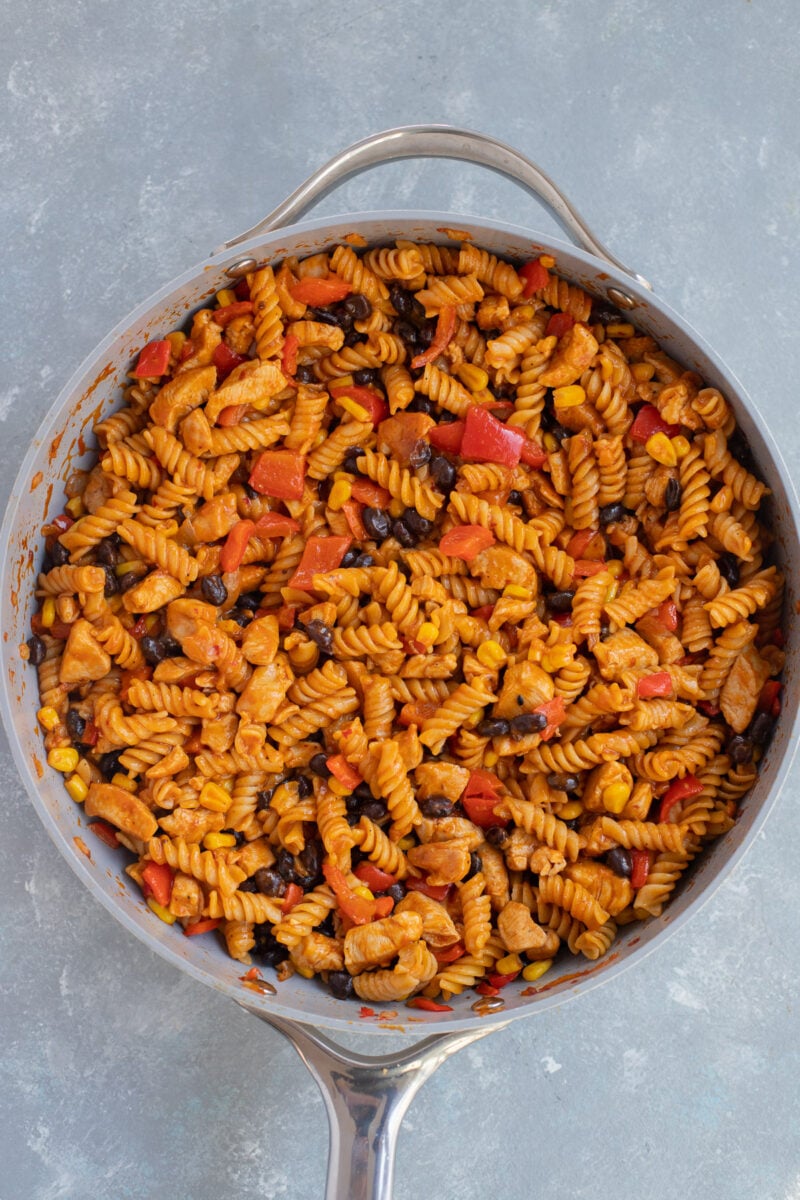 Chicken Enchilada Pasta in a skillet after cooking.