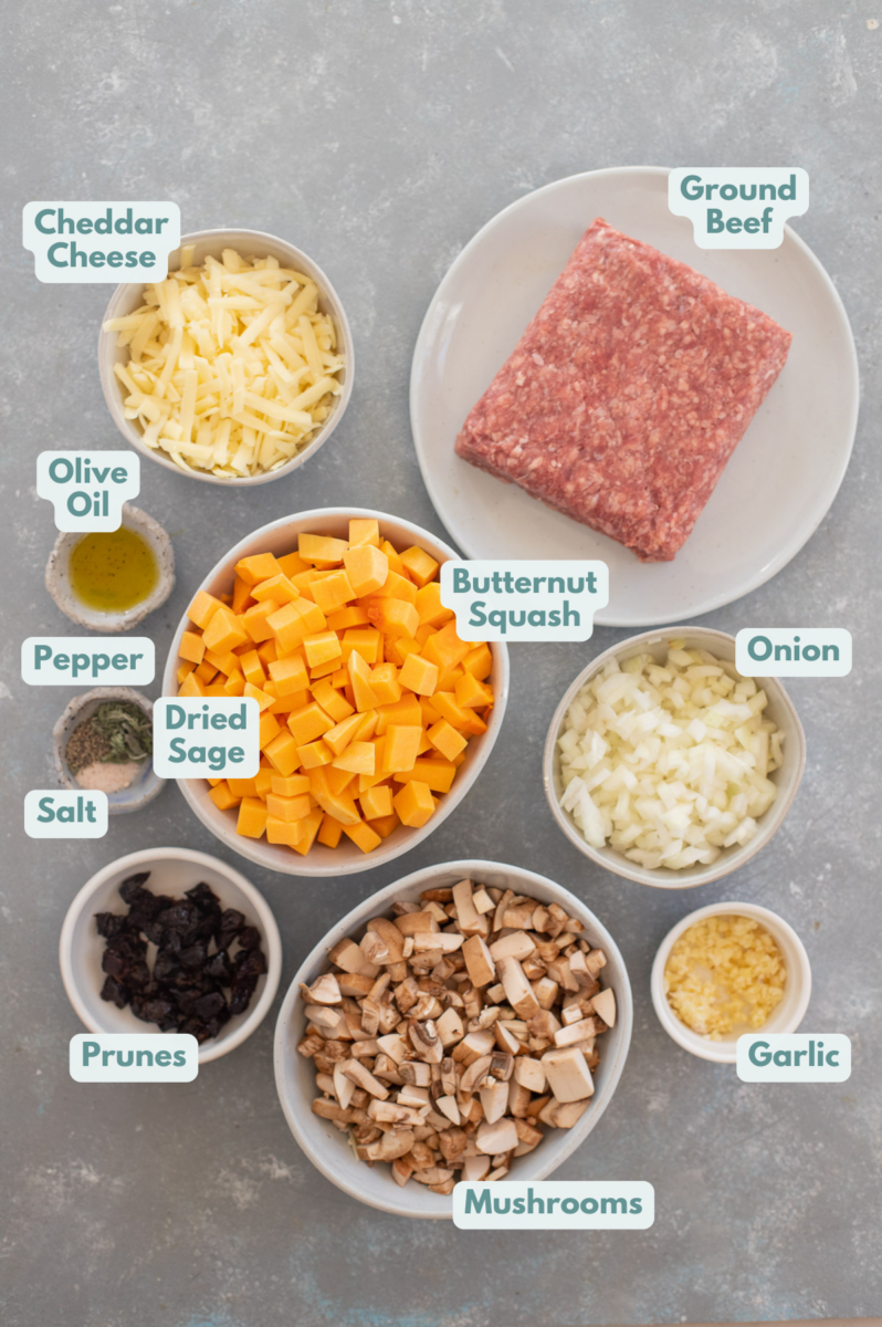 Ingredients for ground beef butternut squash in bowls on a grey counter.