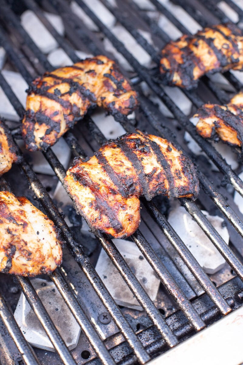 Greek Yogurt Marinated Chicken Thighs on a grill.
