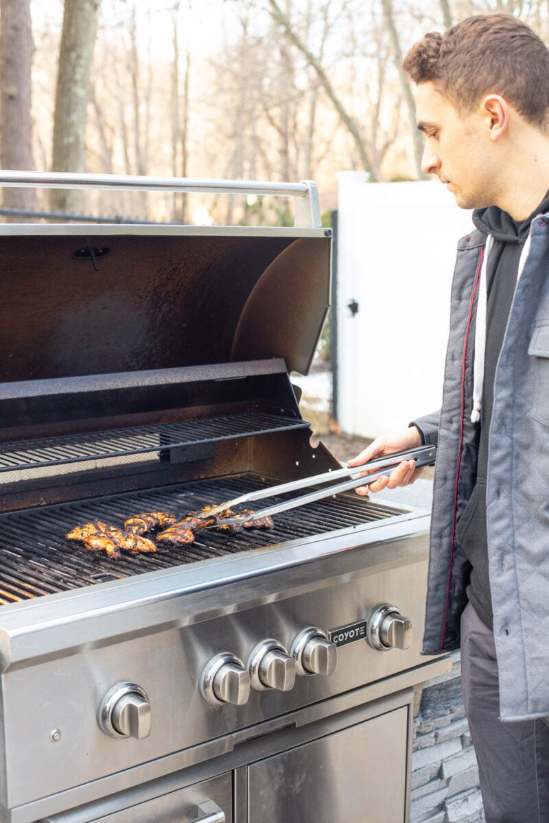 Tyler Marino grilling on a coyote gas grill.
