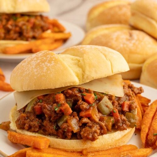 Healthy sloppy joes sandwich with sweet potato fries on the plate.