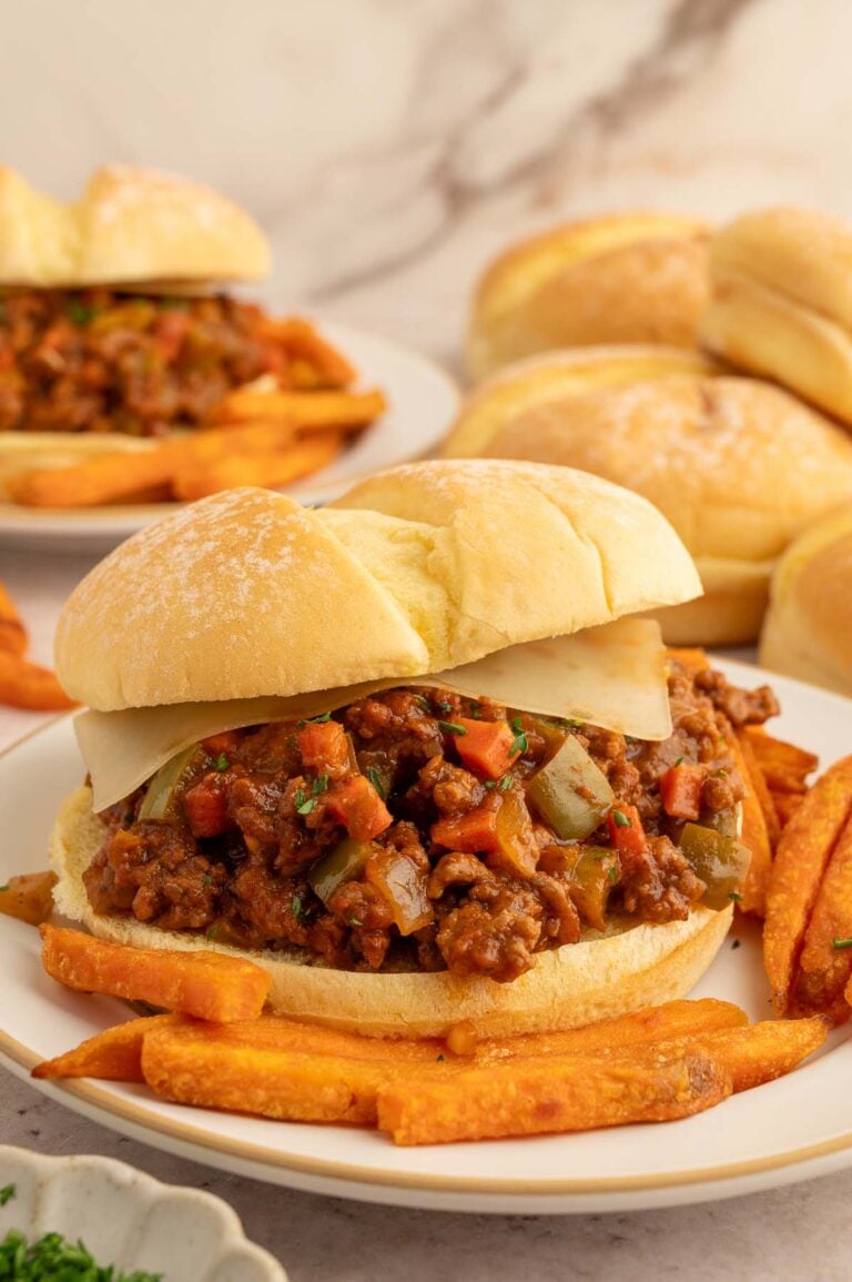 Healthy sloppy joes sandwich with sweet potato fries on the plate.