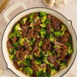 A pan of healthy beef and broccoli on a counter.