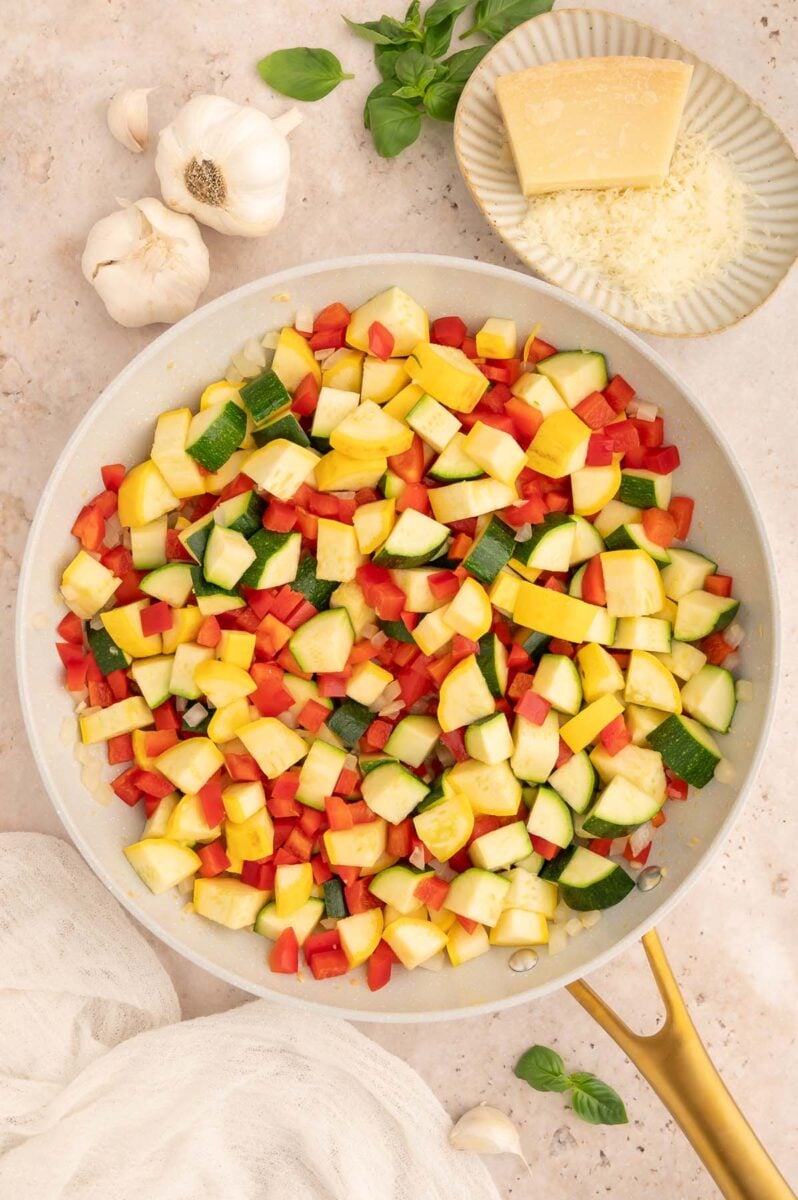 Chopped veggies in a saute pan.