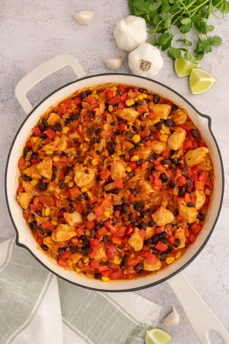 Chicken Taco Rice in a large saute pan before topping with cheese.