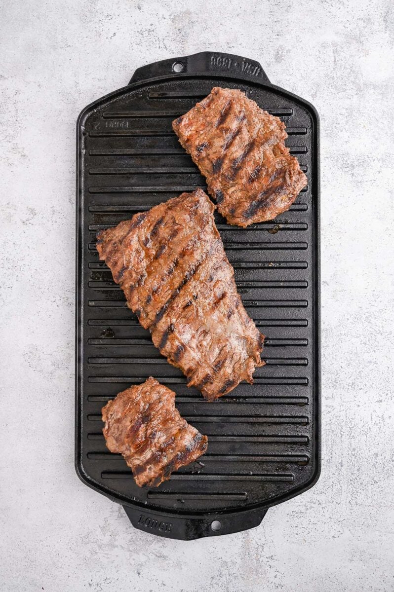 Chili Lime skirt steak on a grill pan with grill lines. 