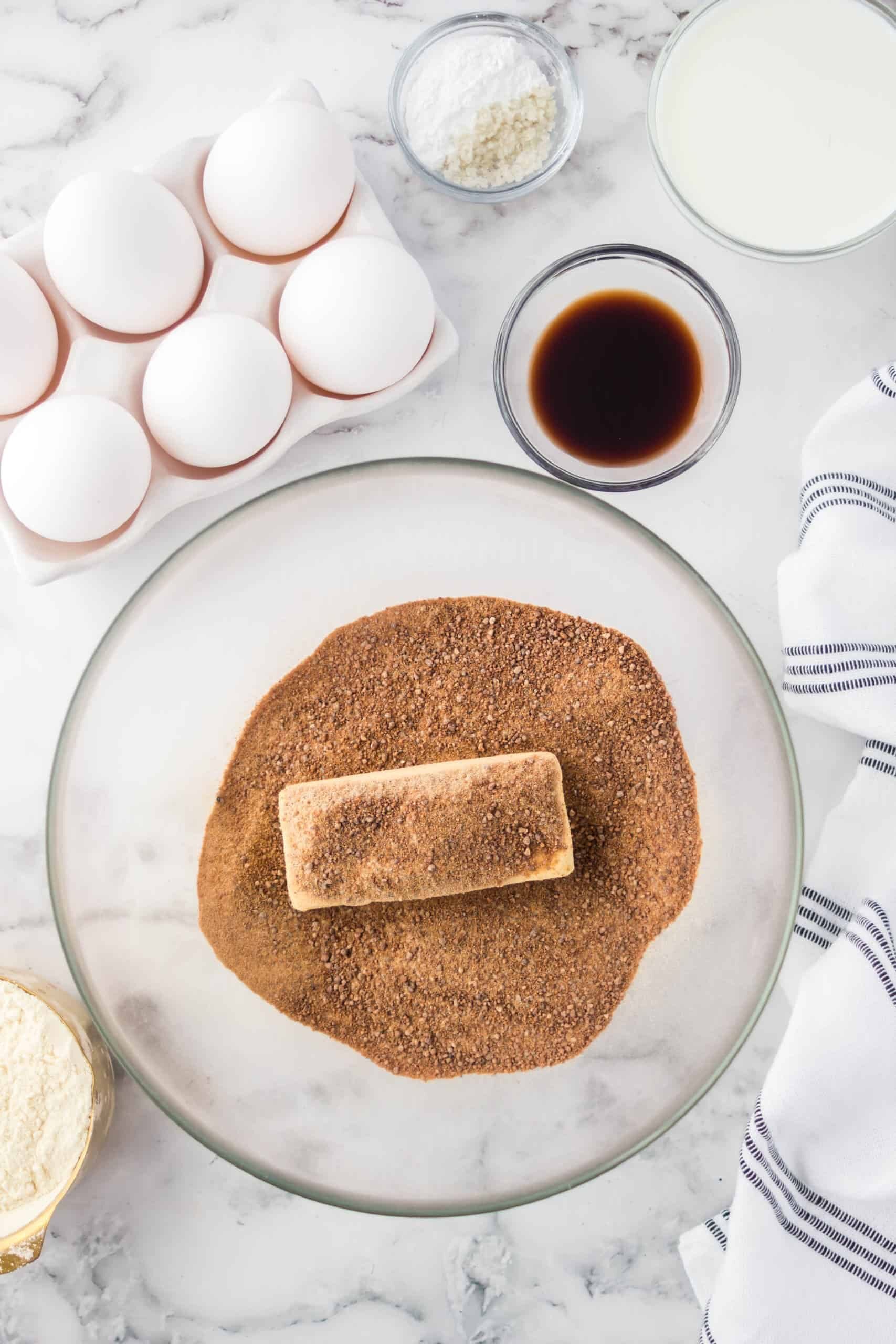 Stick of butter and coconut sugar in a glass mixing bowl.