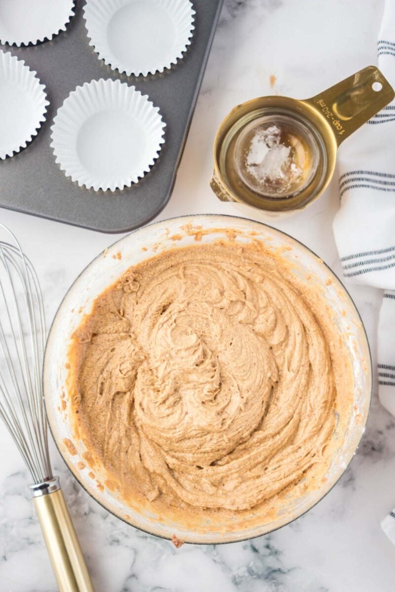 Overhead, looking down on a mixing bowl filled with coconut sugar cupcake batter.