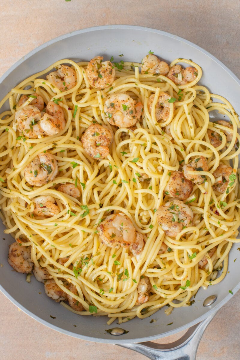 Close up of shrimp scampi in a large saute pan.