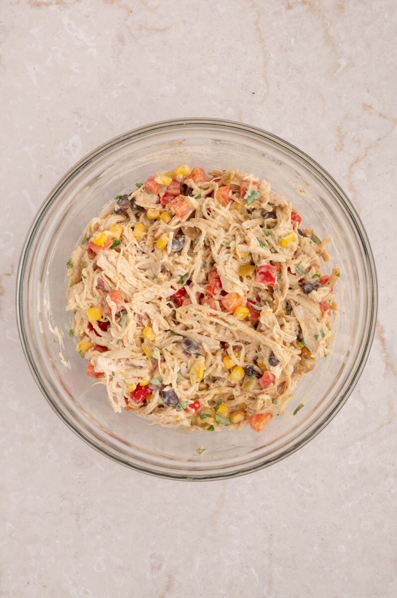 Taco chicken salad in a glass bowl.