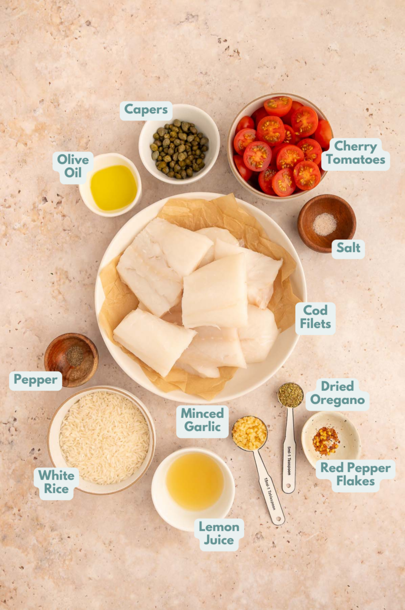 Labeled ingredients to make baked cod in small bowls and measuring cups.