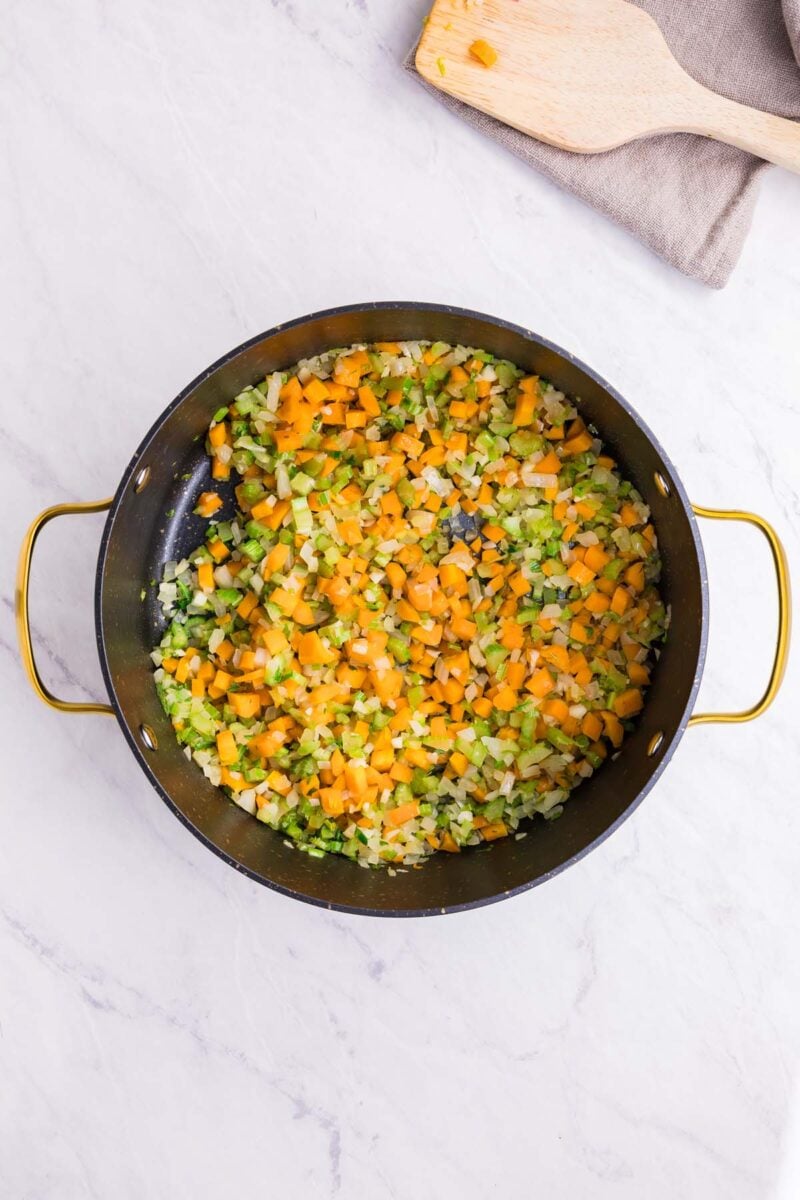 Carrots, celery, onion and garlic cooking in oil in a large stock pot. 
