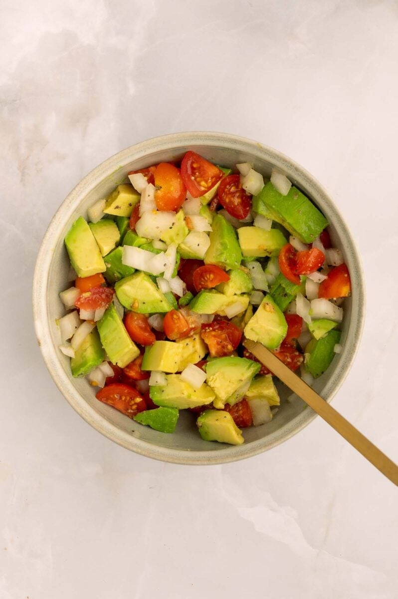 Avocado Tomato taco topping in a bowl for fish tacos.
