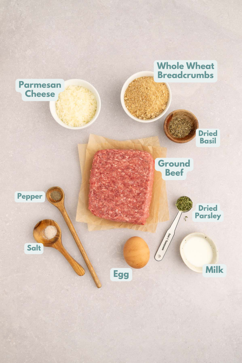 Labeled ingredients to make meatballs for italian wedding orzo in small bowls and measuring cups.