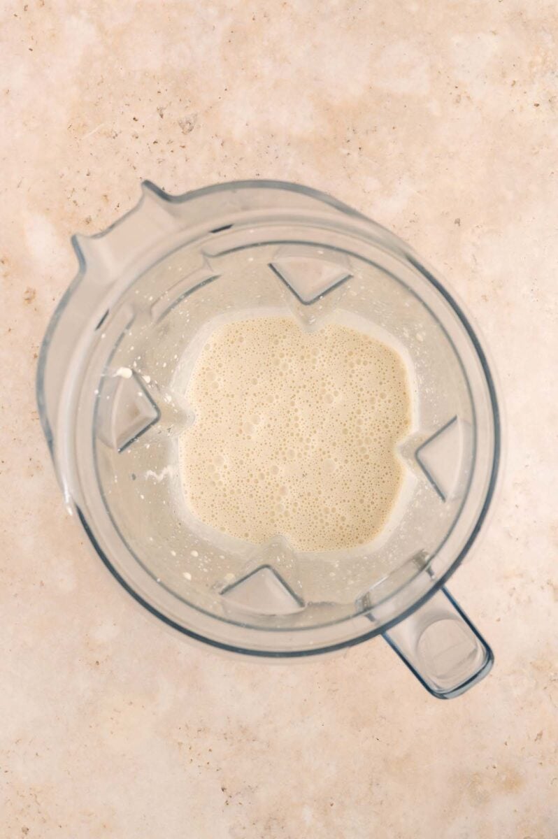 Batter for cheddar cheese savory pancakes in a blender after blending together.