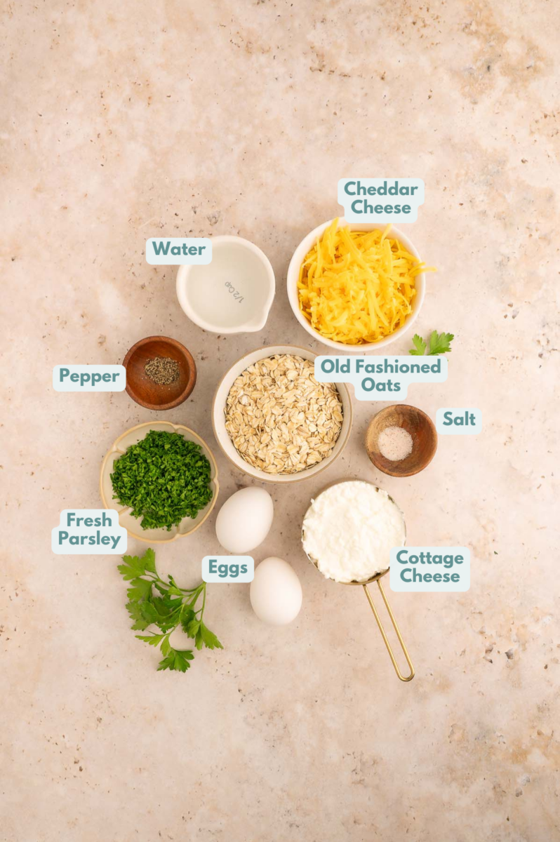 Labeled ingredients to make cheddar cheese savory pancakes in small bowls and measuring cups.