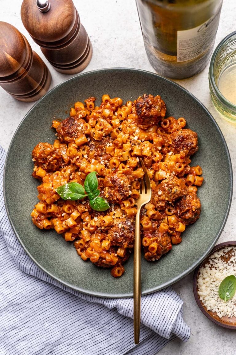 One Pot Meatball Pasta on a plate with a fork in it.