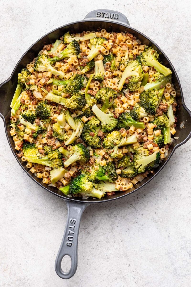 One pot of sausage broccoli pasta in a pan.